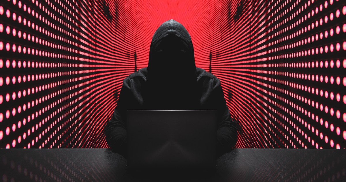 Anonymous-hacker-with-laptop-in-front-of