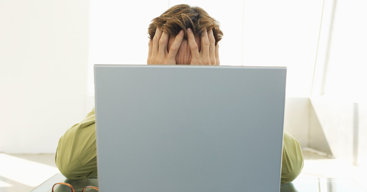 Stressed-Businessman-Using-Laptop.jpeg
