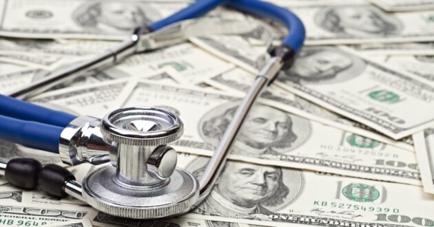 heap of dollars with stethoscope