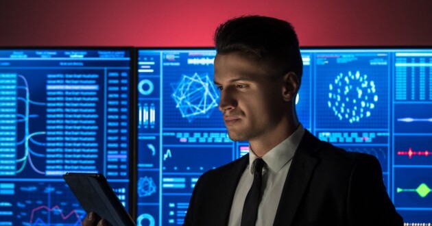 The businessman holding a tablet in the red lab